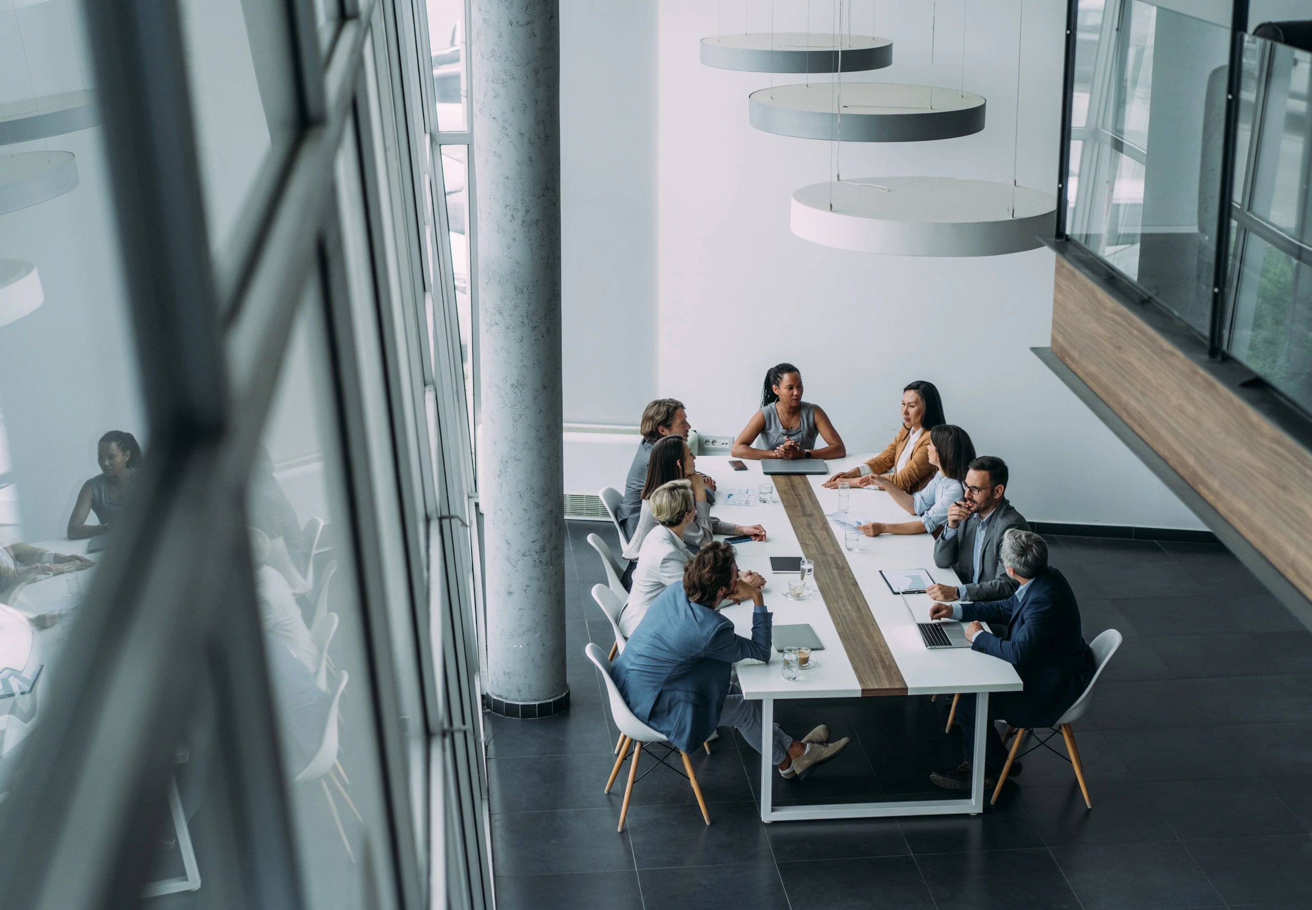 Leadership team meeting in a modern boardroom